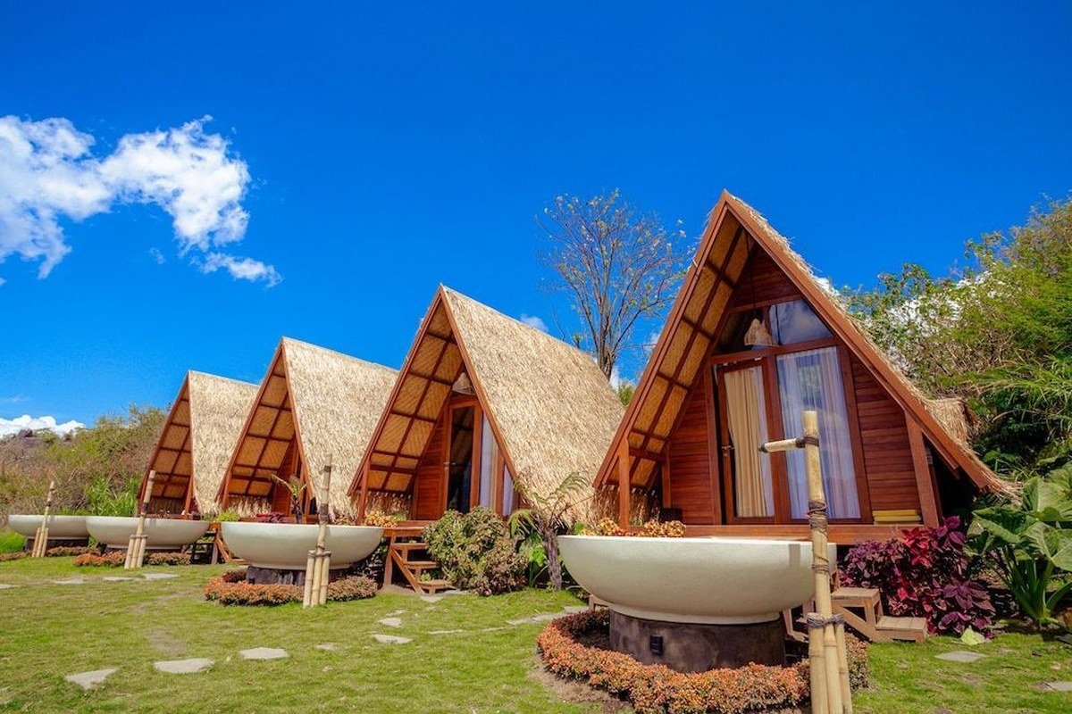 Balinese-style A-frame huts with bathtubs
